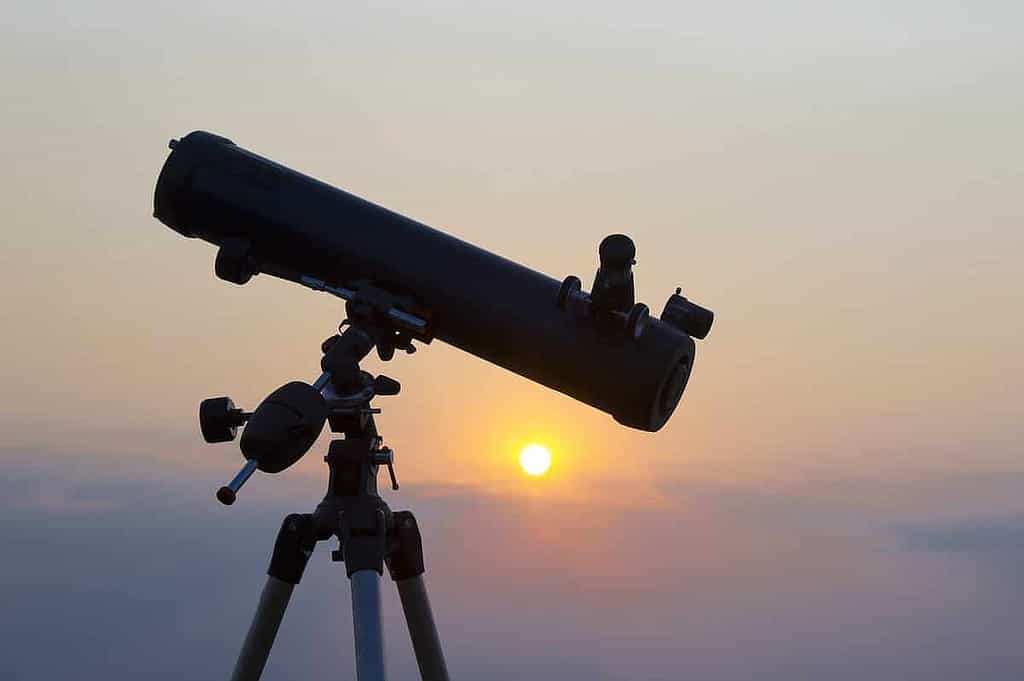 the telescope silhouette at orange sunset