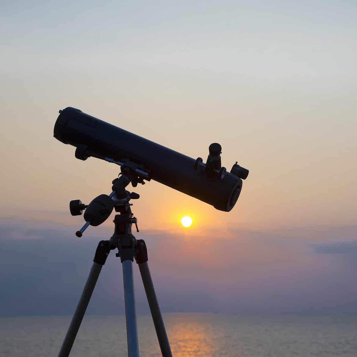 the telescope silhouette at orange sunset