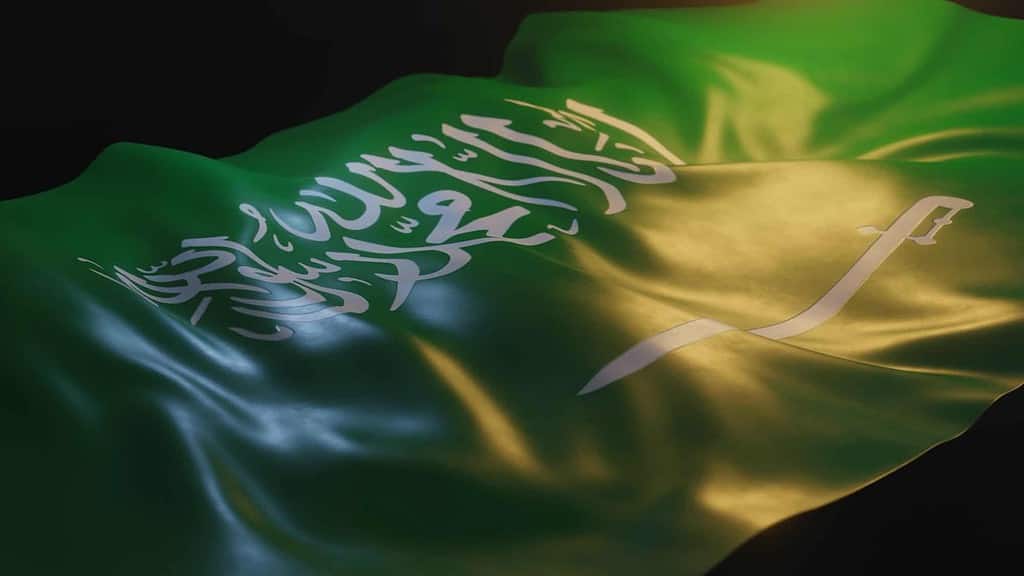 Saudi Arabia Flag Close up with Warm Lighting on Black Background