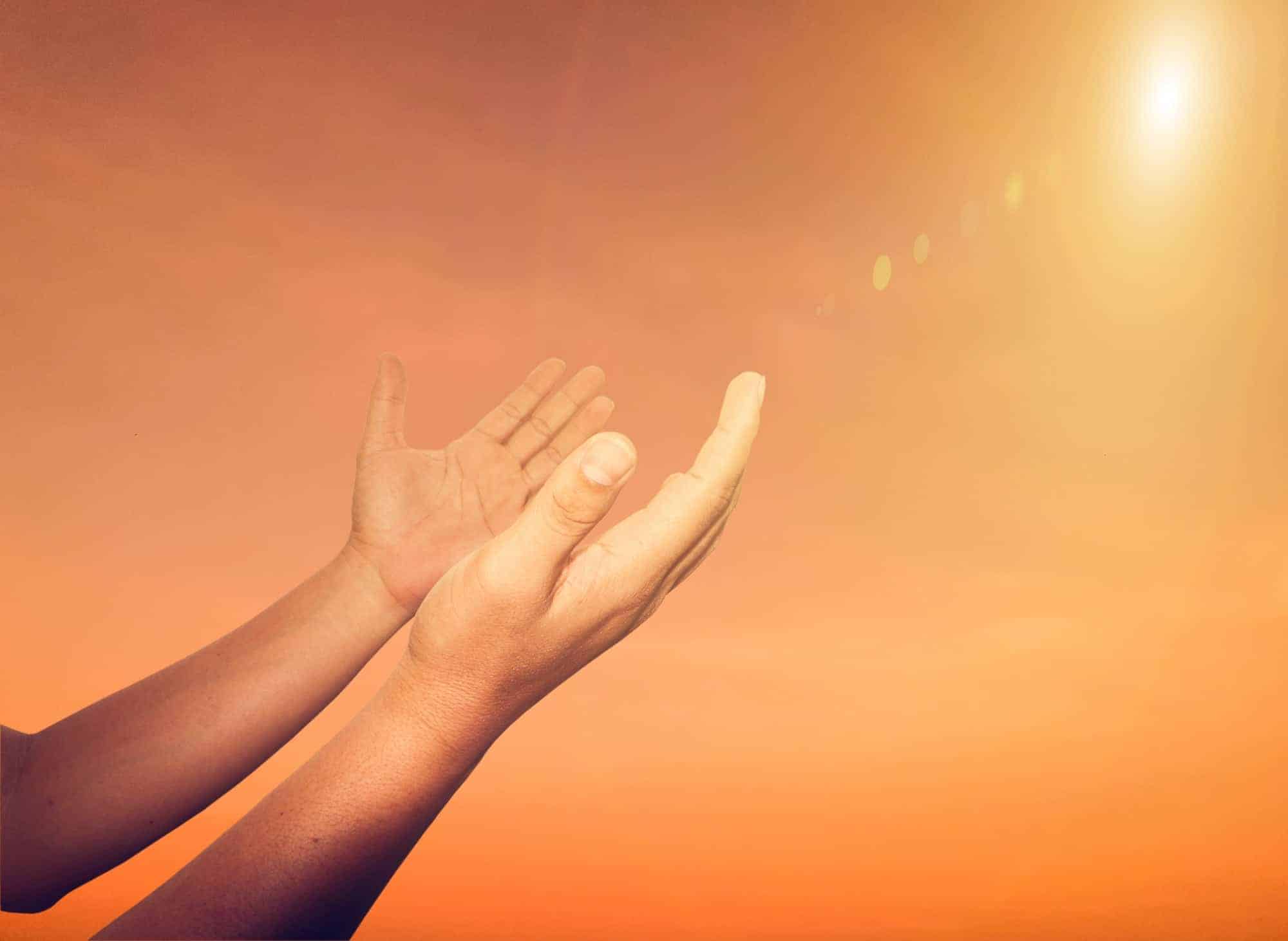 A man praying hand for blessings When the sun goes down Hope for a happy life