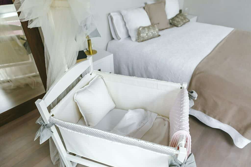 Bedroom with cot and double bed