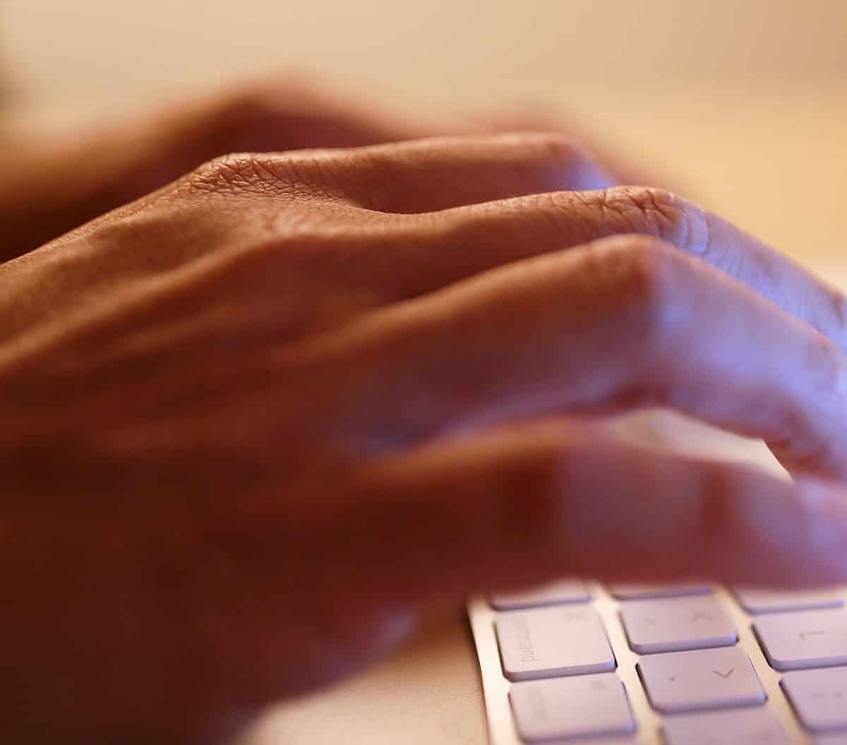 Typing on laptop computer